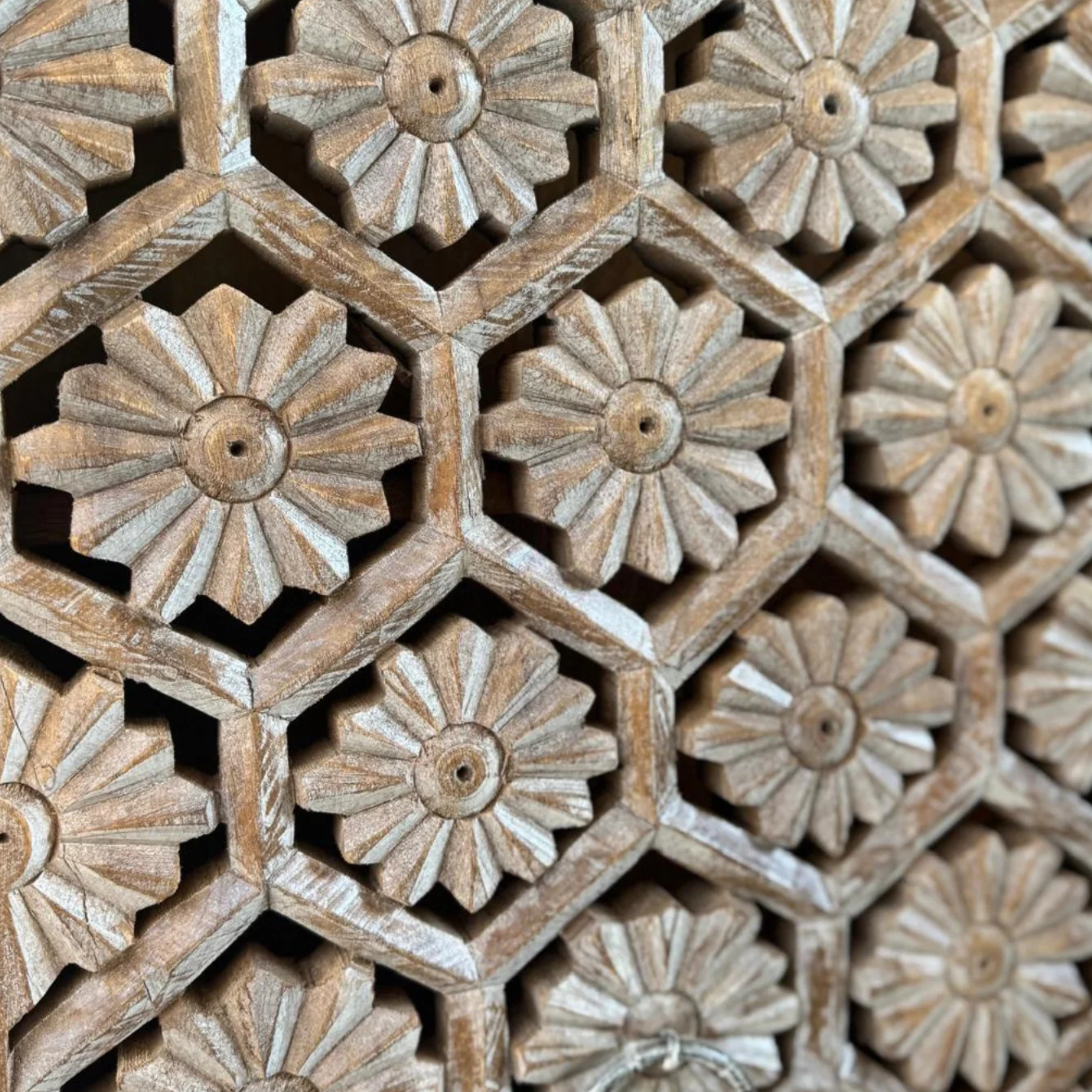 Close-up of a wooden lattice with floral patterns