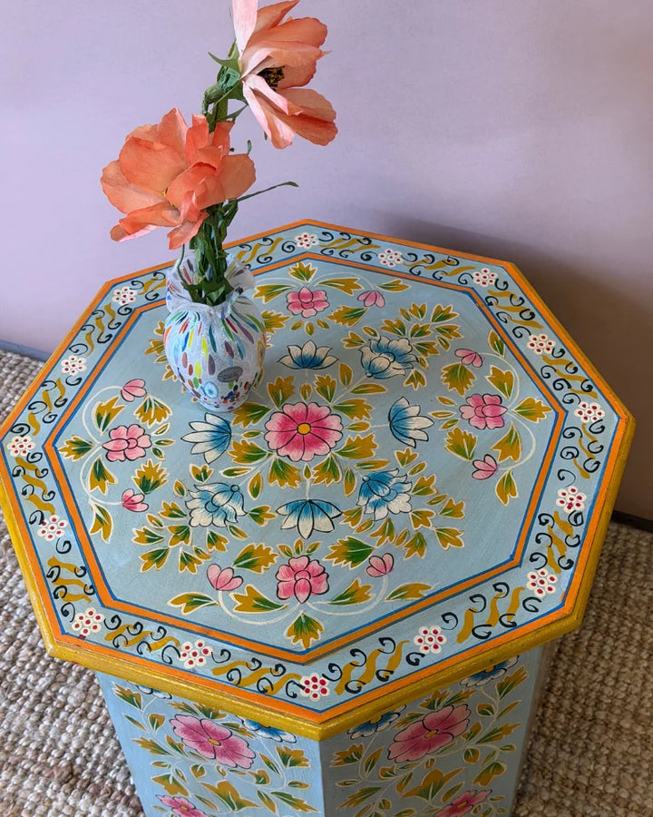 Close-up top-down view of a hand-painted octagonal side table&
