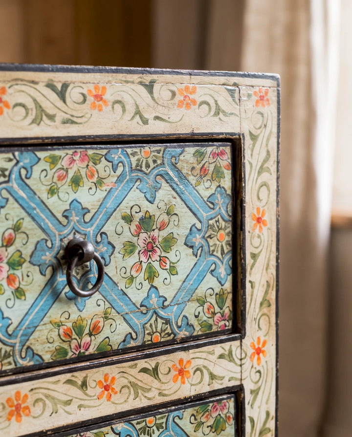 A close up of a 3 drawer hand painted mango wood chest of drawers