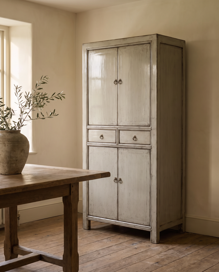 Grey lacquered pine pantry cabinet in a country dining room