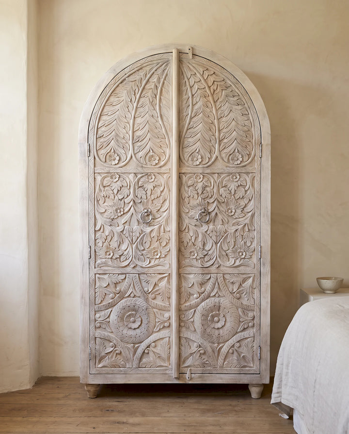 Creamwashed Arched Mango Wood Armoire with Hand-Carved Botanical Doors
